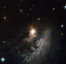 Reflection nebula IRAS 10082-5647 observed by the Hubble Space Telescope. IRAS 10082-5647.jpg