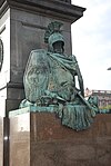 Fama-skulpturen, på norra sidan om Gustav II Adolf-monumentet