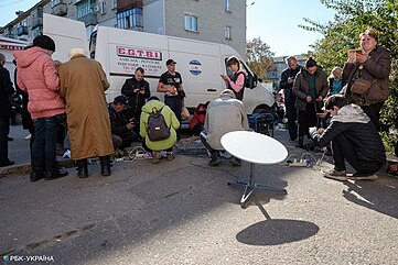 Starlink providing Internet to residents of Kupiansk after the battle that ended in September 2022. There were still no communications, power and water supply in the city. Kupiansk after Russian occupation (2022-10-09) 12.jpg