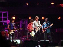 The Oxford Dictionary of Music states that the term "pop" refers to music performed by such artists as the Rolling Stones (pictured here in a 2006 performance). Rolling stones - 11 luglio 2006 - san siro.jpg