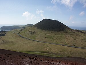 The cone of Helgafell volcano seen from the su...