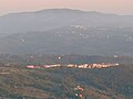 Il borgo di Riparbella visto, al tramonto, dalla vetta del Poggio di Nocola.