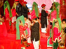 Benteng Chinese wedding in Jakarta, 2012. Benteng people are one of Peranakan community that still exist until today, mostly concentrated in Tangerang, Jakarta and its outskirt area. Cina Benteng wedding.jpg