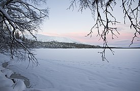 Frozen lake Pallasjärvi and Pallastunturi ridge