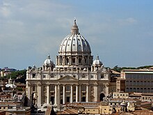 St Peter's Basilica, Vatican City, a major basilica of the Catholic Church, is a central-plan building, enlarged by a basilical nave Petersdom von Engelsburg gesehen.jpg