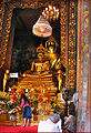 The statues of Phra Phuttha Chinnasi (front) and Phra Suwannakhet (back) in the main shrine hall. The ashes of King Rama IX are kept under the base of the statues