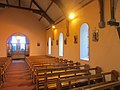 Quilty Church north wall with Stations of the Cross