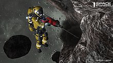 An astronaut mining an asteroid using a hand drill in the video game Space Engineers. Space Engineers 13.jpg