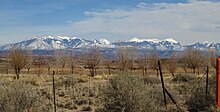 A modern photograph of the LaSal mountains from the vantage point of Dalton Wells.