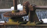 Bevel gear used to lift floodgate by means of central screw.