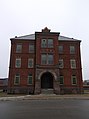 Building 'G' of Humber College's Lakeshore Campus. It is the former Administration Building for the former Lakeshore Psychiatric Hospital, and is currently the only building on the property yet to be developed for the College's use.