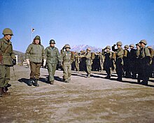 Eisenhower (left) reviews troops of the Republic of Korea's Capitol Division, December 1952 December 4, 1952 - Dwight D. Eisenhower (left) reviews troops of the Republic of Korea's Capitol Division 77 18 867.jpg