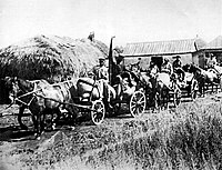 A "Red Train" of carts from the "Wave of Proletarian Revolution" collective farm in the village of Oleksiyivka, Kharkiv oblast in 1932. "Red Trains" took the first harvest of the season's crop to the government depots. During the Holodomor, these brigades were part of the Soviet Government's policy of deliberately taking away food from the peasants.