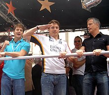 Paddick on a float at the London Gay Pride parade on 30 June 2007 with, from his right, actor John Barrowman and Barrowman's partner Scott Gill John Barrowman at London Gay Pride 2007.jpg