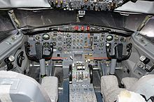 The nose gear tiller is visible as a semi-circular manual control to the left of the yoke in this photo of a Boeing 727 cockpit. MM00756-4.jpg