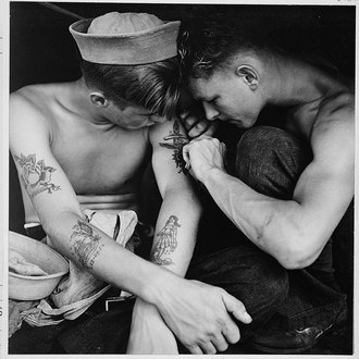 Much tattooed sailor aboard the USS New Jersey [Dec 1944][15]