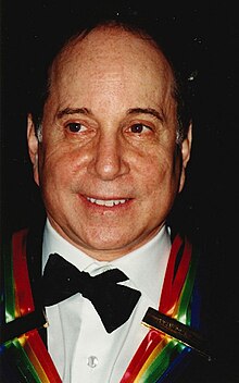 Simon wearing the Kennedy Center Honors ribbon in 2002 Paul Simon 2002.jpg