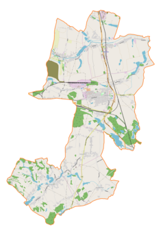 Mapa konturowa gminy Pawłowice, blisko centrum na prawo znajduje się punkt z opisem „Parafia św. Jana Chrzciciela”