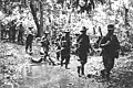 Australian troops of B Company, 30th Infantry Battalion, crossing a shallow creek between Weber Point and Malalamai