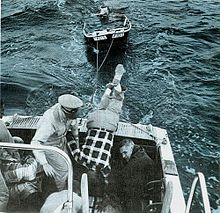 Auxiliarists in 1967 rescuing a boater off an outboard that had foundered during a storm in Long Island Sound, New York. USCGAUXR2E2.jpg