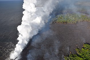 Hot lava entering the ocean creates a dense white plume
