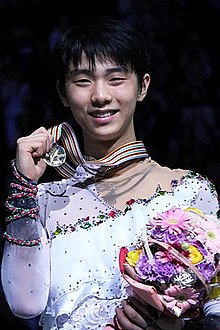 Hanyu on the podium at the victory ceremony of the 2014 World Championships