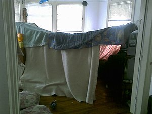 English: A blanket fort suspended on strings.