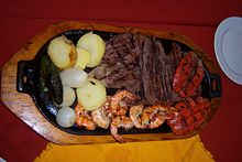 Grilled arrachera, shrimp, sausage, onions, potatoes and chiles toreados served on an iron skillet. Carne de Arrachera.jpg