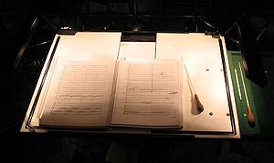 A conductor's score and batons