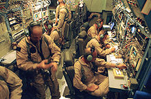 U.S. Military personnel assigned to the 4th Psychological Operations Group, 193rd Special Operations Wing, Pennsylvania Air National Guard (PA ANG) broadcast television and radio programming Interior of an EC-130J Commando Solo Mar 2003.jpg