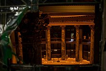 The rotunda as viewed through a broken Tiffany-glass window Looking through broken glass.jpg