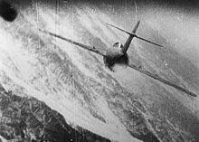 Gun camera photo of a MiG-15 being attacked by a USAF fighter. MiG-15 in a dogfight with USAF.jpg