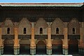 Details of the interior facade of the central courtyard; note the window portals into the dormitory cells.