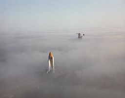 Space Shuttle Challenger moving through fog