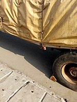 Wheel chock placed under a car's wheel.