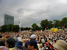 Anti-Nuclear Power Plant Rally on 19 September 2011 at Meiji Shrine complex in Tokyo in which sixty thousand people marched chanting "Sayonara nuclear power" and waving banners to call on Japan's government to abandon nuclear power following the Fukushima disaster Anti-Nuclear Power Plant Rally on 19 September 2011 at Meiji Shrine Outer Garden 03.JPG