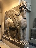 Lamassu, initially depicted as a goddess in Sumerian times, when it was called Lamma, it was later depicted from Assyrian times as a hybrid of a human, bird, and either a bull or lion—specifically having a human head, the body of a bull or a lion, and bird wings, under the name Lamassu.[91][92]