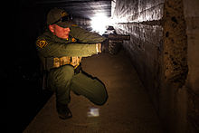 Patrolling a tunnel in Nogales, Arizona Border Patrol Agent in Nogales, Arizona.jpg
