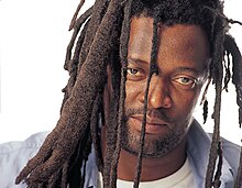 close-up of Lucky Dube looking directly at camera with slight smirk on his face