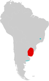 Map of South America marked by red and blue colors, with the red color extending over Uruguay and into Rio Grande do Sul, southern Brazil, and the blue color in southeastern Minas Gerais, eastern Brazil, and in two different areas in northern and southern Buenos Aires Province, eastern Argentina.