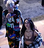 Baker and Megan Fox at the 2022 NBA Celebrity All-Star Game on February 18, 2022 Machine Gun Kelly and Megan Fox (51914406561) (cropped).jpg