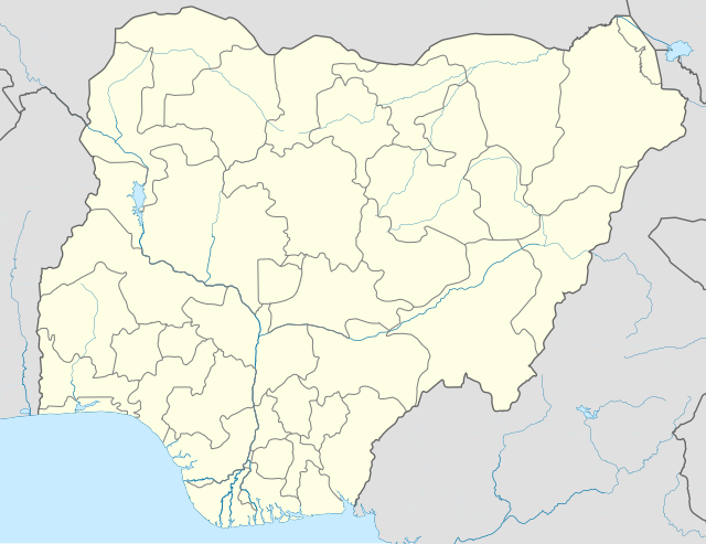 Mapa konturowa Nigerii, blisko dolnej krawiędzi nieco na lewo znajduje się punkt z opisem „Port Harcourt”