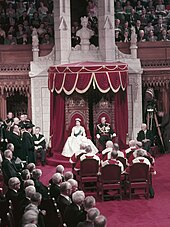 Queen Elizabeth II and Prince Philip at the opening of the 23rd Canadian Parliament, 14 October 1957 Queen Elizabeth II and Prince Philip sit on thrones before a full Parliament.jpg