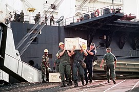 Seabees unloading crates from 1st Lt. Baldomero Lopez during Operation Desert Storm on 1 August 1990