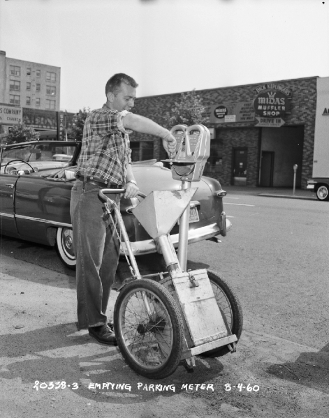 File:Seattle - Worker emptying parking meter, 1960.gif