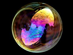 Interference produces a light show on a soap bubble.