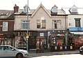 Two-storey building with shops on lower storey