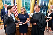 Esper, with his wife Leah, is sworn in as Secretary of Defense by Justice Samuel Alito on July 23, 2019. Swearing-in Ceremony for Secretary of Defense Mark Esper (48374478966).jpg