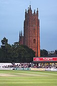 The tower of St. James Church rises over the County Ground