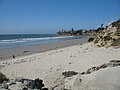 A view of the beach at Tourmaline Surfing Park looking north, with False Point in La Jolla visible in the distance. September 2006